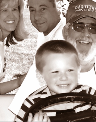 Jameson Quinn at wheel, with Grandpa Jack Daniels. Patti Quinn and Kevin Quinn at rear.